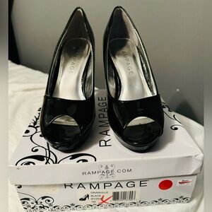 Lightly used Platform black heel by Rampage